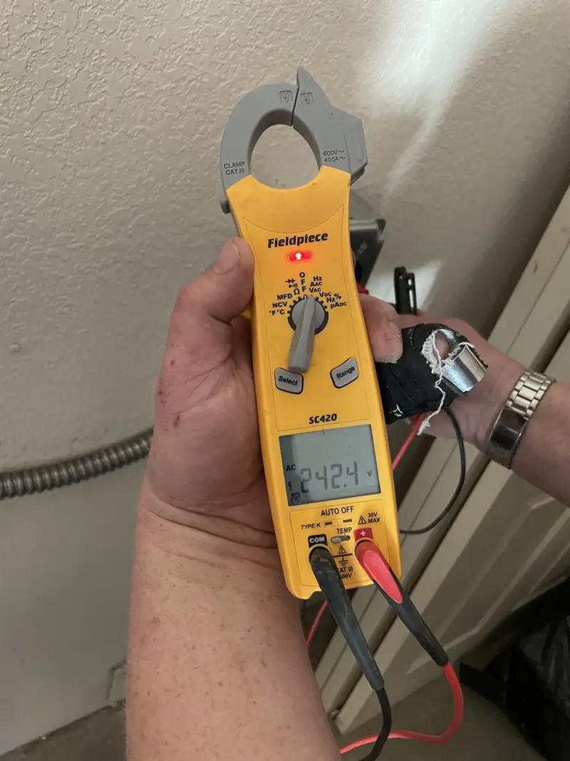 Voltage testing with clamp meter during Ceiling Fan Installation in Gonzalez